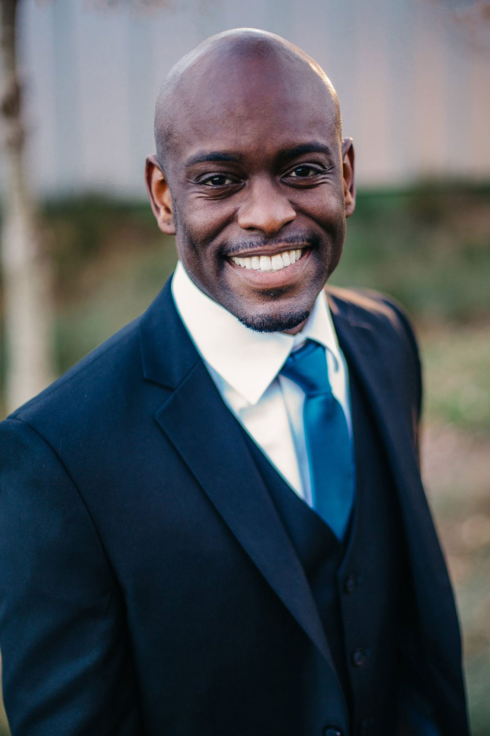 Close-up of Brian smiling during his branding photoshoot in Raleigh, NC