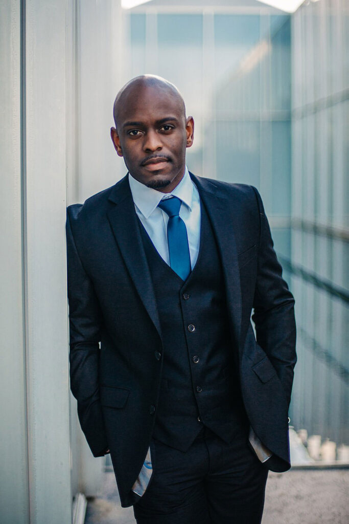 Brian, Financial Strategist, confidently posing at the NC Museum of Art for headshots