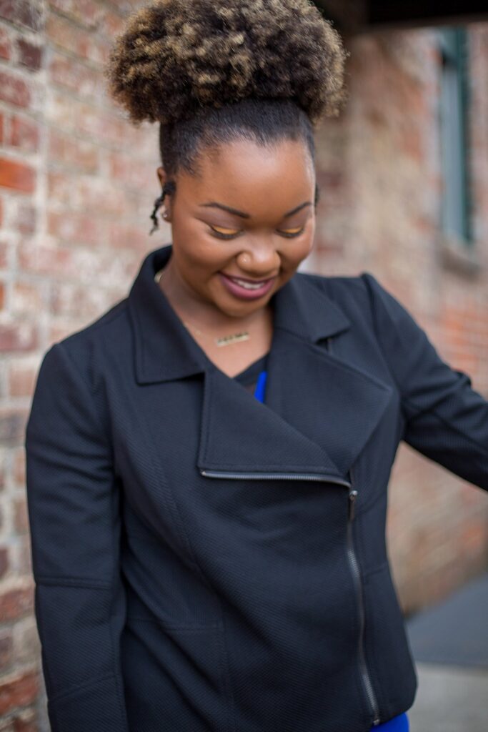 candid woman headshot pose in downtown greenville nc 