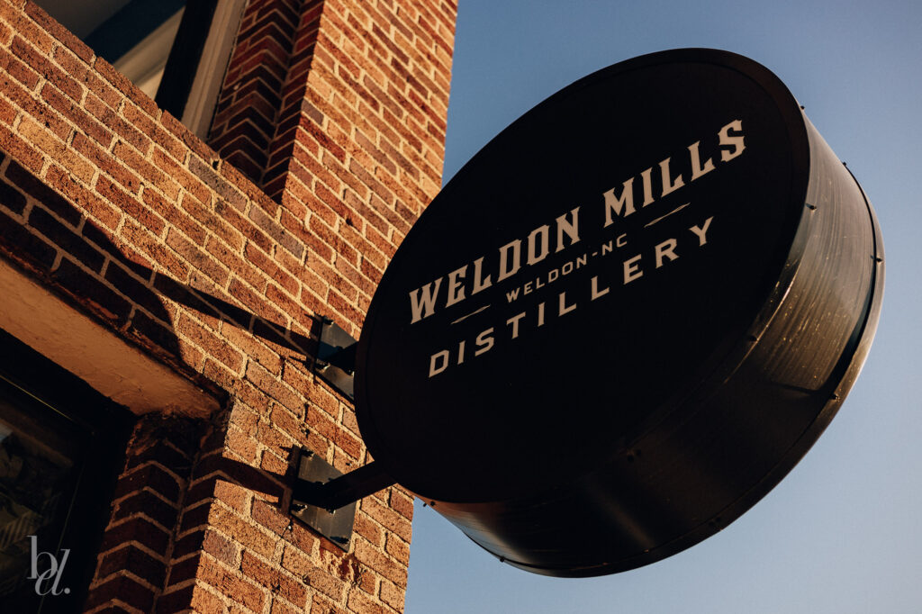 exterior sign at weldon mills distillery in durham nc
