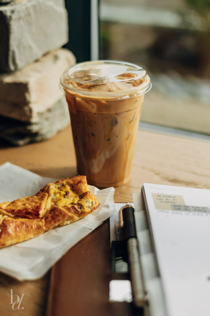 Iced latte and croissant at a popular Morrisville coffee shop near Cary NC