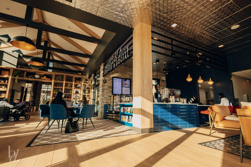 Interior of Land of a Thousand Hills Coffee Shop with comfy couches and tables