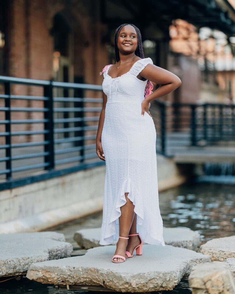 High school senior girl posing with confidence at American Tobacco Campus Durham