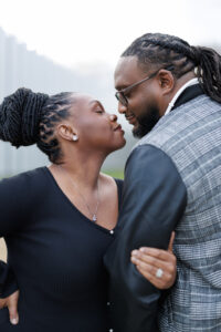 Close up of a couple with foreheads nearly touching, sharing a tender and emotional moment during an engagement photo session