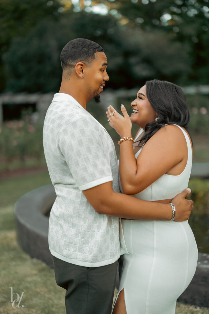 Joyful reaction immediately after a proposal during an outdoor engagement session in Raleigh.