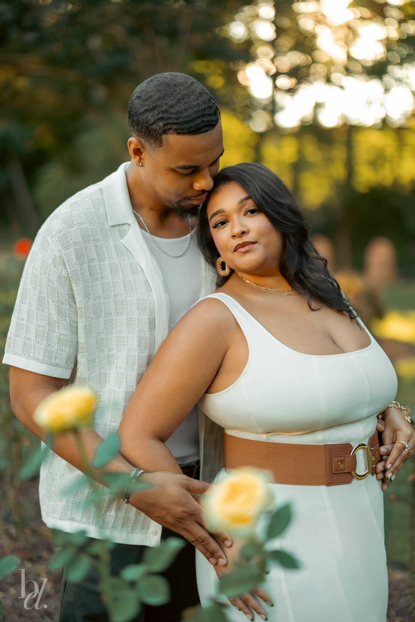 Intimate portrait of a couple embracing during a garden engagement photoshoot in Raleigh, North Carolina.