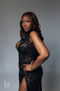Close up portrait of woman in black lace dress during luxury birthday photoshoot