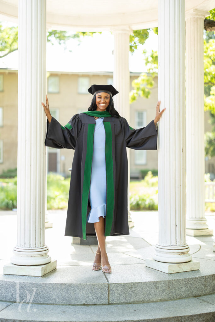 UNC Old Well graduation portrait with columns and doctoral regalia