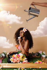 Creative birthday studio portrait with clouds, florals, and one of the birthday girl's baby chicks