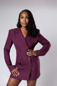 Editorial doctoral graduation portrait in plum blazer dress in Raleigh studio